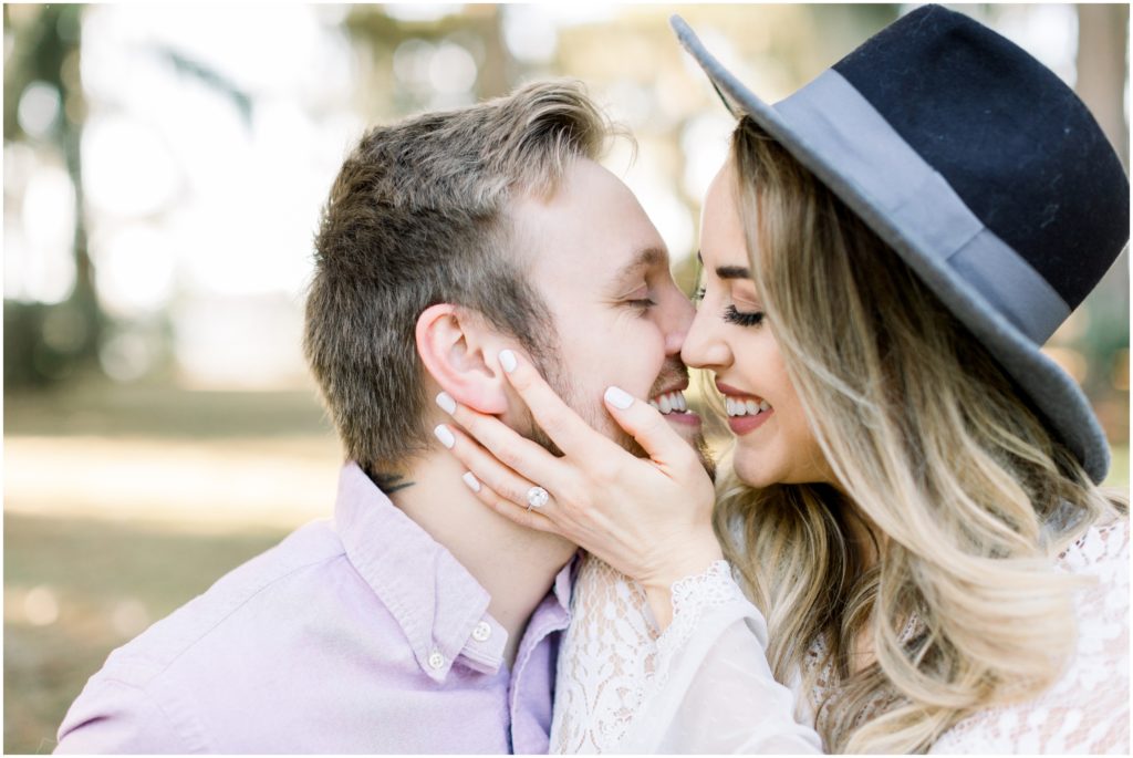 girl wearing hat for engagement photos