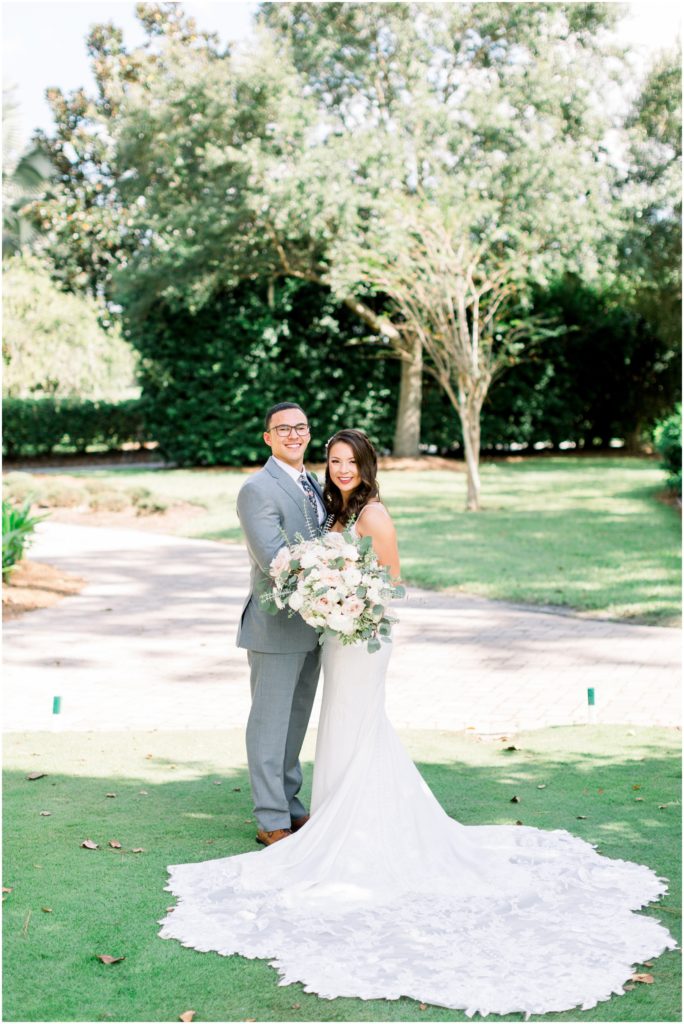 groom with grey suit and bride with fitted lace gown