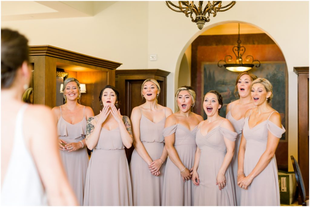 bride doing a first look with her bridesmaids